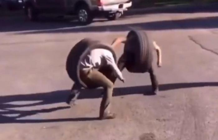 Two guys in tires are fighting